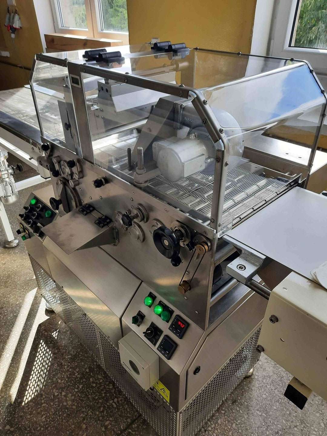 Coating machine integrated with a sharpener